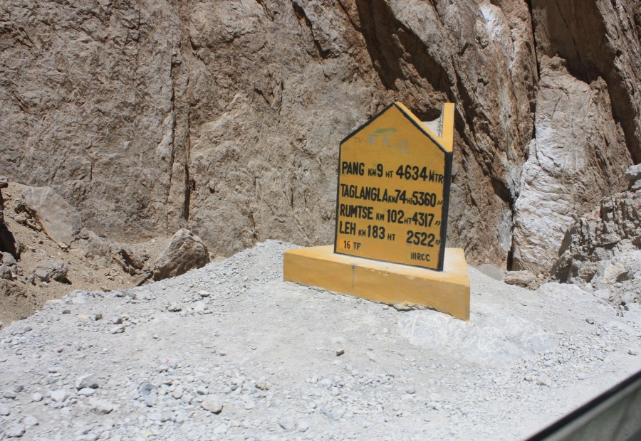 Sign with distances and altitudes of our upcoming towns. Leh was the final destination.